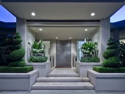 The form floating design creates room under the staircase for a small office. Exquisite Modern Blue Ridge Mansion In Seattle Modern Front Door Mansions Front Door Steps