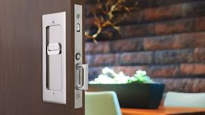 A coin or screwdriver can be used to unlock the door in an emergency. Modern Rectangular Pocket Door Mortise Lock Emtek Products Inc