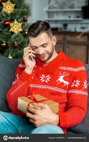 Maybe you would like to learn more about one of these? Smiling Man Talking Smartphone Holding Gift Box Sofa Christmas Tree Free Stock Photo C Igorvetushko 215233876