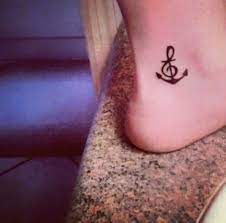 See more ideas about tattoos, foot tattoos, body art tattoos. Best Tattoo Wrist Cross Treble Clef Ideas Foot Tattoos Cool Tattoos Trendy Tattoos