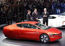 Car Of The Future Volkswagen Xl1 Geneva 2013 Where Are The Back Wheels Volkswagen Futuristic Cars Futuristic Cars Concept