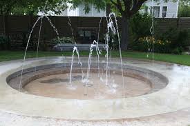 Overall, a splash pad works by circulating water from an underground storage tank to the play area by means of a pump. A Backyard Splash Pad Is A Fun And Safer Alternative To A Swimming Pool Backyard Splash Pad Backyard Backyard For Kids