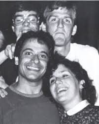 Generational service to our college and country: Lt. John Bailey Moore '24  (U.S. Marine Corps) salutes his grandfather, Dr. Carl Walsh '62 (U.S. Air  Force captain, retired). Moore graduated from Officer Candidate