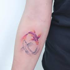 The golden or yellow koi fish is associated with wealth and gold. Koi Fish Tattoos Popsugar Beauty