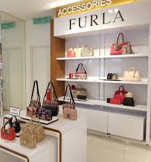 Klia duty free shops at the kuala lumpur international airport offers a wide range of products to suite all kinds of travelers moving in and out of malaysia. Furla Teams Up With Heinemann For Klia2 Corner Opening Global Travel Shopping Guide
