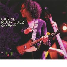 Curly texican fiddles with reckless abandon. Store Carrie Rodriguez