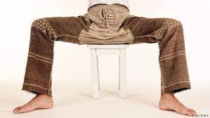 A Person Sitting On A Stool Shows Off A Pair Of Pants Jan Evers European Music Old Musical Instruments Musicals
