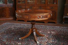 Antique round 54″ diameter mahogany dining table with 5 original leaves. Mahogany Drum Table Duncan Phyfe Drum Table With Drawers