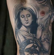 Amazing grey ink masonic eye tattoo on upper back. Top 10 Masonic Tattoo Designs