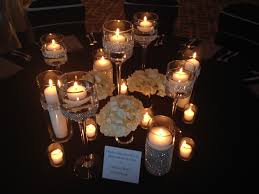 Elegant Candle Centerpiece Lots Of Candles Rhinestone Wrapped Vases Flo Floating Candle Centerpieces Candle Centerpieces Elegant Candle Wedding Centerpieces
