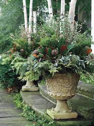 Pin By Kim Spencer On Holidays Winter Container Gardening Winter Planter Christmas Urns