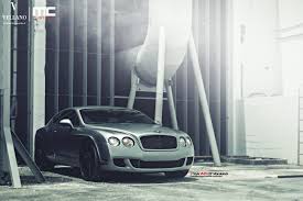 Custom Parts On Gray Bentley Continental Giving It A Mysterious Appearance Car Wallpapers Bentley Continental Bentley Motors