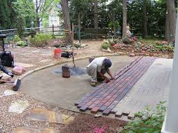 Current thinking is to take up the weed blanket, break up the slabs. Installing Pavers Over Your Existing Patio Is A Great Way To Change The Look Of Your Outdoor Space Hometalk