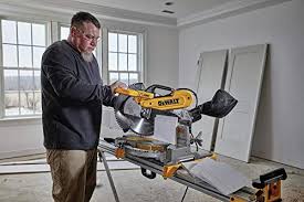 Grasp the lock pin, which is the small, cylindrical button on the right side of the saw arm, just above the main pivot joint. How To Unlock A Dewalt Miter Saw 10 Steps Easy Guide 2020