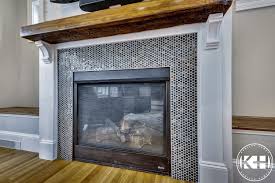 It's not a bad fireplace at all, we actually liked the brick, but we've seen some great looking herringbone marble tile added to other fireplaces and decided we really wanted that too. Family Room Farmhouse Fireplace Ideas With Reclaimed Wood Blue Penny Round Tile White Shiplap Reclaimed Wood Fireplace Fireplace Penny Round Tiles