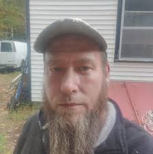 Why does my 2003 Yamaha YZ125 feel hesitant and sputter in first gear?