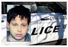 A Jersey City motorist caught snoozing in a hatchback with a stolen license  plate