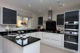 Soft gray cabinets look fantastic with granite countertops too, as. Another Great Example Of A Black And White Kitchen With Silver Accessories Kitchen Design Modern Small Modern Kitchen Design Kitchen