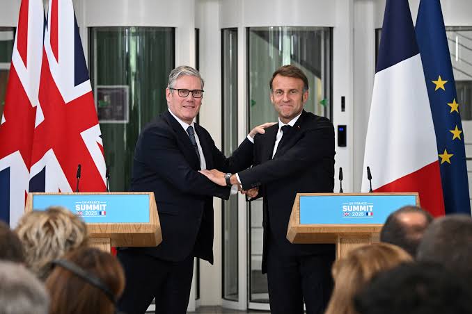 UK to start implementing migrant returns deal with France within days | Reuters