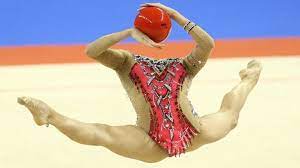 Female athletes perform expressive and acrobatic moves with the aid of handheld apparatus — a hoop, ball, pair of clubs and ribbon. What Are The Four Apparatus In Rhythmic Gymnastics As Com