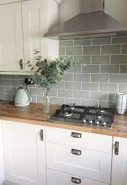 The wall material corresponds with the kitchen's theme that looks vintage. 33 Awesome Backsplash Kitchen Wall Ideas That Every People Want It Kitchen Wall Tiles Design Kitchen Remodel Small Green Kitchen Backsplash