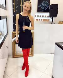Red Thigh High Boots Combined With Black Pantyhoses And A Short Black Dress Thighhighboots Black Short Dress Thigh High Boots Fashion