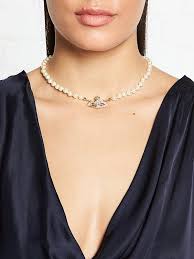 The collection was filled with easy shapes, and all of the westwood signatures — loose drapes of fabric across the bust and shoulders of a minidress; Vivienne Westwood Mini Bas Relief Pearl And Orb Choker Necklace Gold Very Co Uk