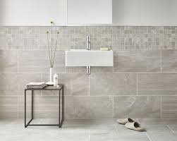 See how top designers create lovely loos with marble, ceramic, porcelain and glass tile. Bathroom Tile Ideas Use Large Tiles On The Floor And Walls Large Tiles That Flow From The Flo Wall And Floor Tiles Bathroom Wall Tile Grey Marble Bathroom