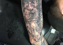 Father and son watching sunset tattoo design on rib cage ideas for guys. Father Time Jesse Vickers