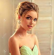 Opt for an inverted bob haircut and wear the fringe on one side. Beautiful Woman Dressed In Evening Gown Example Of Wedding Hairstyle Stock Photo Picture And Royalty Free Image Image 85037413