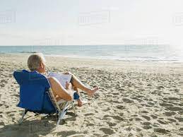 Man Relaxing In Beach Chair Stock Photo Dissolve