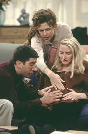 He hugs her and wipes her tears. 1x09 Tow Underdog Gets Away Ross Shh Singing Here We Come Walkin Down The Street Get The Funniest Looks From E Carol Friends Friends Moments Friends Tv