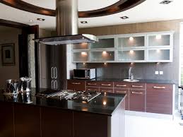 With a dark granite counter top, especially one that pulls in interesting pops of color like orange, i would almost suggest a darker backsplash. Dark Granite Countertops Hgtv