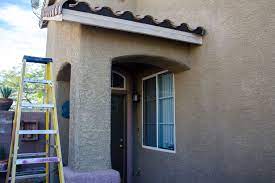 How To Hang Christmas Lights On Stucco Hunker Hanging Christmas Lights Christmas Lights Outside Christmas Hanging Decorations