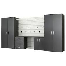Black moduline cabinets in front of a few classic cars. Flow Wall Modular Wall Mounted Garage Cabinet Storage Set With Workstation Accessories In White Graphite Carbon Fiber 5 Piece Fcs 72w 04scb The Home Depot Garage Storage Cabinets Storage Cabinets Modular Walls