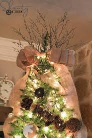 A gorgeous rustic tree with a wooden barrel christmas tree collar. How To Decorate A Rustic Christmas Tree Shanty 2 Chic