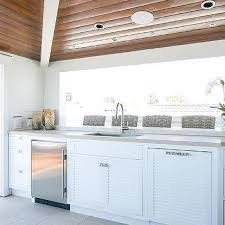 Photo of the room after the mirror and vanity had been removed and cabinet had the first coat of primer applied. Gray Shiplap Outdoor Kitchen Cabinets Design Ideas