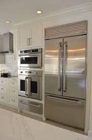 A kitchen layout will take into account the 'working triangle', referring to the cooking journey from fridge, to sink to oven. White Kitchen With Driftwood Peninsula Koby Kepert Kitchen Appliances Layout Kitchen Designs Layout Kitchen Design Small
