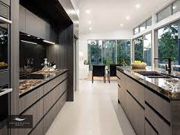 Kitchen And Living Details Including Black And Gold High End Kitchen Square Set High Ceilings Porcelain Tiles Handless Kitchen High End Kitchens Kitchen