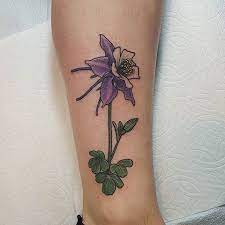 Darl grey iris flower tattoo on back. Pin On Tattoos Piercings