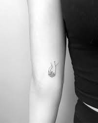 The most common hold hands tattoo material is metal. Holding Hands Tattoo On The Left Inner Arm