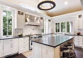 White cabinets pair well with nearly every countertop style. White Kitchen Cabinets With Dark Countertops Designing Idea
