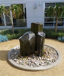 Maybe you would like to learn more about one of these? I Love This Basalt Water Feature Surrounded By Large Stones A Concrete Circular Border And D Backyard Water Feature Water Features In The Garden Rock Fountain