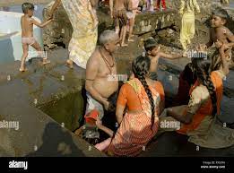 Family enjoying bathing in hot water spring at Akloli near Vjreshwari Thane  district ; Maharashtra ; India ; Asia Stock Photo - Alamy