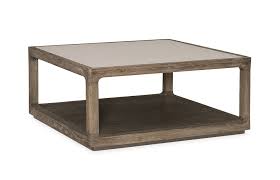 The top of this cocktail table features a grey and black mosaic tile inlay. Fusion Cocktail Table Caracole
