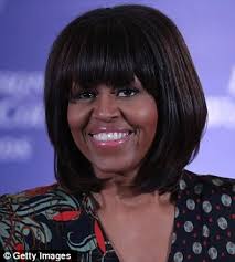 Karl Lagerfeld said Michelle Obama and French news presenter Marie-Aline Meliyi (right) could be sisters with the First Lady&#39;s recent choice of bangs - article-2291738-1886DC54000005DC-896_306x340