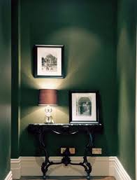 Dark Rooms British Racing Green Walls In An Entry Hall Via Atticmag Green Painted Walls Dark Green Walls Dark Painted Walls
