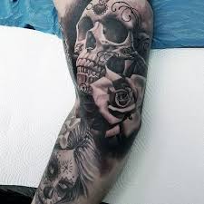 Sugar skull day of the dead tattoo sleeve. Men Sugar Skull Tattoo Full Sleeve With Rose Realistic Skull Sleeve Tattoos Skull Tattoo Design Skull Sleeve