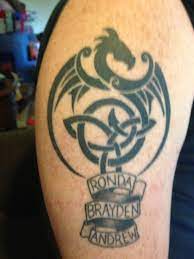 My Husband Designed A Dragon With Trinity Knot In It Then Added Our Kids Names Tattoos With Kids Names Tattoos For Kids Trinity Knot Tattoo