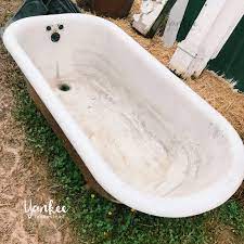 Cast iron bathtubs are known to be more durable than their fiberglass counterparts. How To Refinish A Vintage Claw Foot Tub Roots Boots